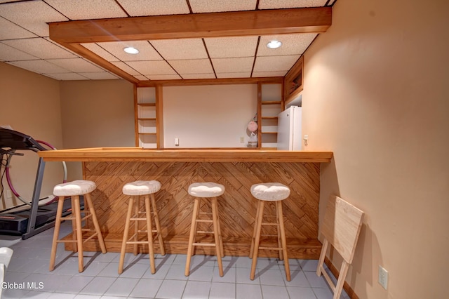 5 Wendfair Ter, Colonie, NY 12205 - indoor dry bar featuring freestanding refrigerator, tile patterned flooring, and recessed lighting
