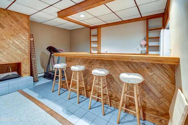 5 Wendfair Ter, Colonie, NY 12205 - indoor dry bar featuring freestanding refrigerator, a drop ceiling, wood walls, and recessed lighting