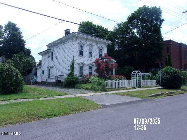 20 N 4th Ave, Ilion, NY 13357 - view of front of home with a chimney