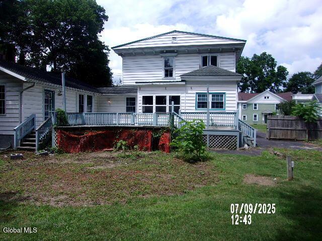 20 N 4th Ave, Ilion, NY 13357 - rear view of property with a wooden deck and stairway