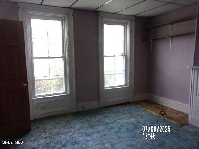 20 N 4th Ave, Ilion, NY 13357 - carpeted spare room featuring plenty of natural light and a paneled ceiling