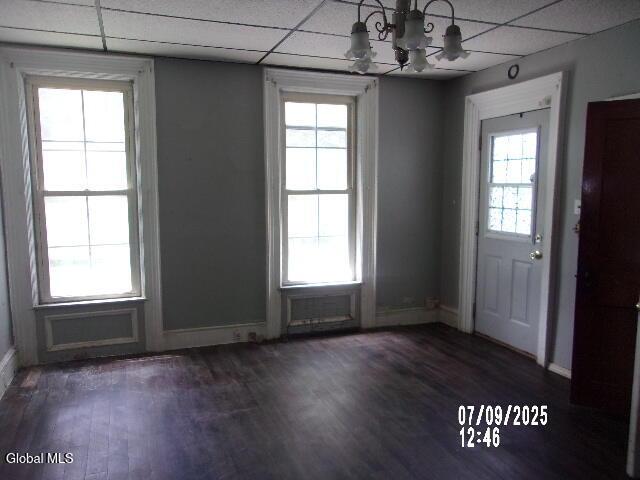 20 N 4th Ave, Ilion, NY 13357 - foyer with a drop ceiling, a chandelier, healthy amount of natural light, and dark wood finished floors