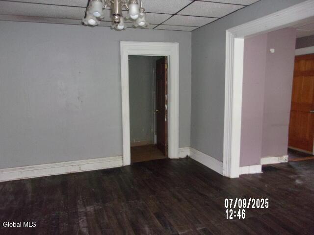 20 N 4th Ave, Ilion, NY 13357 - unfurnished dining area featuring a chandelier, wood finished floors, and a drop ceiling