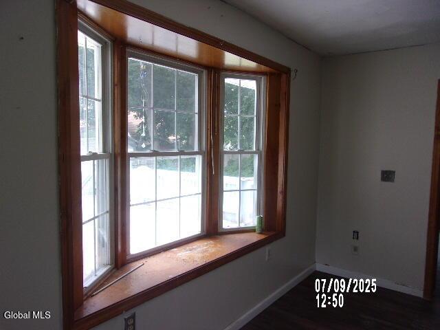 20 N 4th Ave, Ilion, NY 13357 - empty room featuring baseboards and wood finished floors