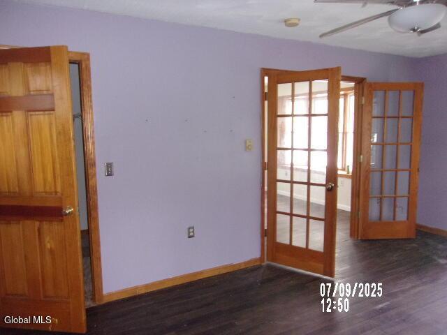 20 N 4th Ave, Ilion, NY 13357 - unfurnished room featuring french doors, wood finished floors, ceiling fan, and a smoke detector