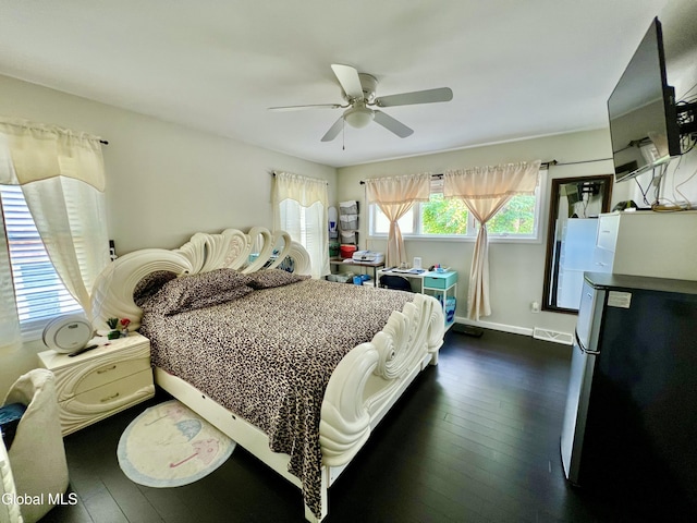 101 Prospect St, Schenectady, NY 12308 - bedroom featuring freestanding refrigerator, dark wood-type flooring, and a ceiling fan
