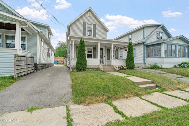 407 Huston St, Scotia, NY 12302 - view of front of home featuring a porch, a front yard, and driveway
