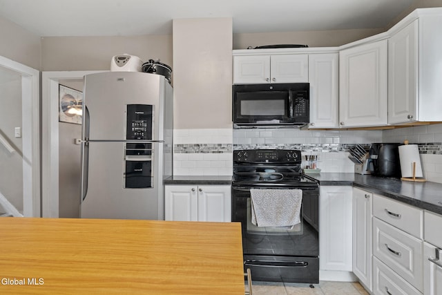 407 Huston St, Scotia, NY 12302 - kitchen with black appliances, dark countertops, white cabinets, and tasteful backsplash