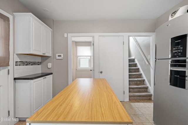 407 Huston St, Scotia, NY 12302 - kitchen featuring freestanding refrigerator, wooden counters, white cabinetry, and tasteful backsplash