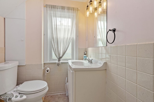 407 Huston St, Scotia, NY 12302 - half bath featuring tile walls, vanity, a wainscoted wall, tile patterned floors, and a chandelier