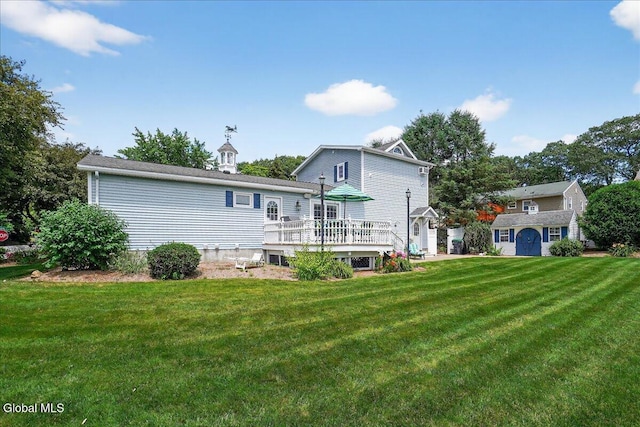 7 Marquette Ave, Colonie, NY 12110 - rear view of property featuring a deck, a yard, and a shed