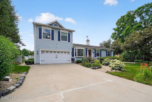 7 Marquette Ave, Colonie, NY 12110 - view of front facade with concrete driveway, a garage, and a front yard