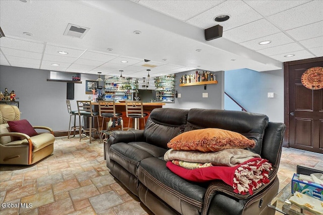 7 Marquette Ave, Colonie, NY 12110 - living room with a bar, a paneled ceiling, light stone finish flooring, and recessed lighting