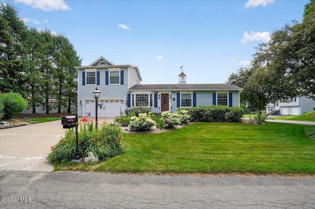 7 Marquette Ave, Colonie, NY 12110 - view of front of home with a garage, concrete driveway, and a front yard
