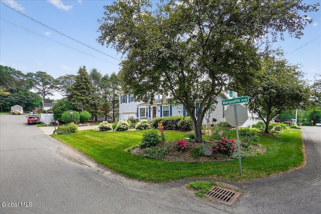 7 Marquette Ave, Colonie, NY 12110 - view of property hidden behind natural elements with a front lawn