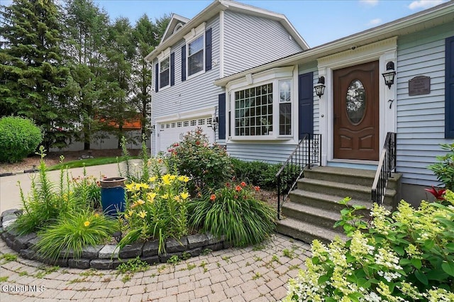 7 Marquette Ave, Colonie, NY 12110 - doorway to property with a garage