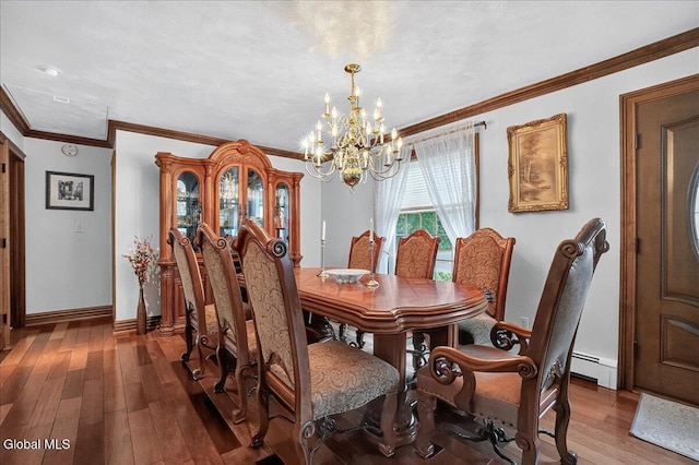 7 Marquette Ave, Colonie, NY 12110 - dining room featuring a chandelier, hardwood / wood-style floors, baseboard heating, and ornamental molding