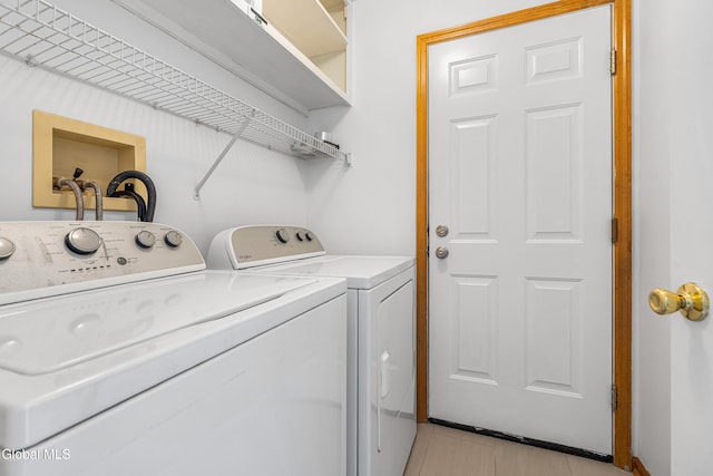 3002 Morgan Ct, Schenectady, NY 12306 - laundry area featuring independent washer and dryer and light tile patterned floors