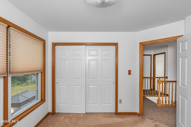 3002 Morgan Ct, Schenectady, NY 12306 - unfurnished bedroom featuring light carpet and a closet