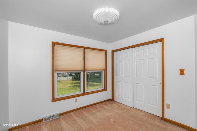 3002 Morgan Ct, Schenectady, NY 12306 - unfurnished bedroom featuring light colored carpet and a closet