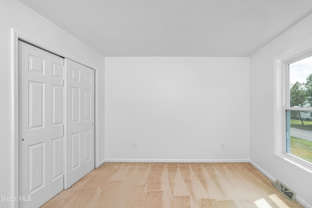 3002 Morgan Ct, Schenectady, NY 12306 - unfurnished bedroom with light colored carpet and a closet