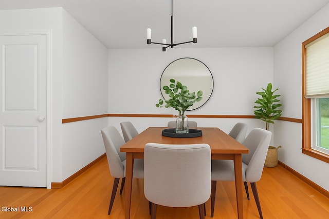 3002 Morgan Ct, Schenectady, NY 12306 - dining area featuring a chandelier and light wood-style flooring