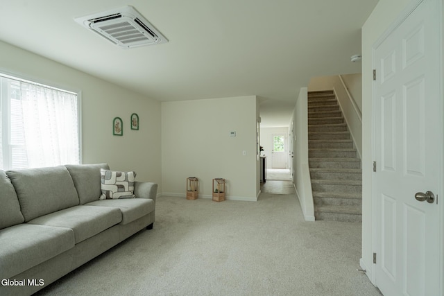 424 Summit Ave, Schenectady, NY 12307 - living room featuring light carpet and stairway