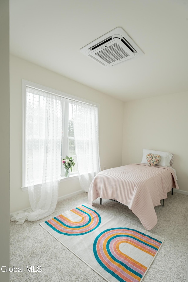 424 Summit Ave, Schenectady, NY 12307 - carpeted bedroom with an AC wall unit and baseboards