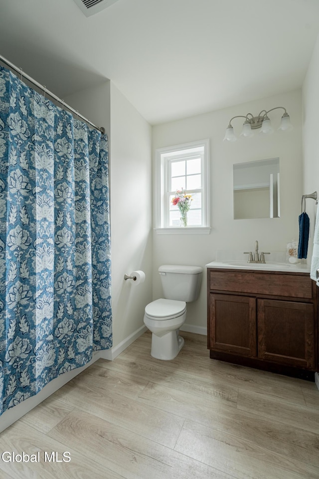 424 Summit Ave, Schenectady, NY 12307 - bathroom with vanity, wood finished floors, and a shower with shower curtain