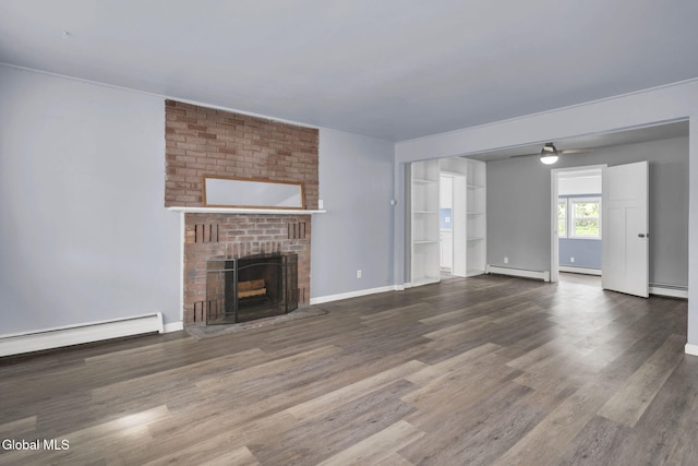 6 Briarwood Rd, Colonie, NY 12211 - unfurnished living room with baseboard heating, wood finished floors, a baseboard heating unit, and a fireplace