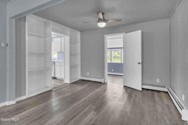 6 Briarwood Rd, Colonie, NY 12211 - unfurnished bedroom featuring baseboard heating, wood finished floors, and a baseboard radiator