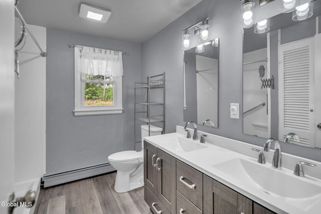 6 Briarwood Rd, Colonie, NY 12211 - full bathroom featuring a baseboard radiator, wood finished floors, double vanity, and a shower