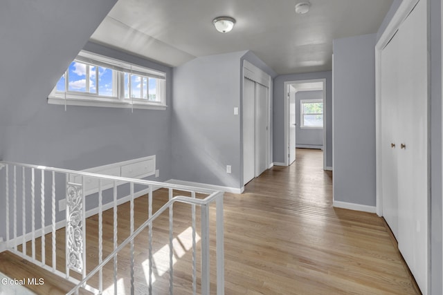 6 Briarwood Rd, Colonie, NY 12211 - hallway featuring an upstairs landing, light wood-type flooring, and a baseboard radiator