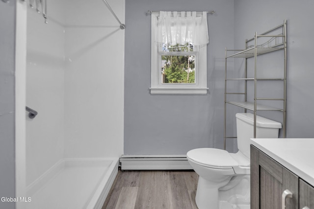 6 Briarwood Rd, Colonie, NY 12211 - full bath featuring a baseboard heating unit, vanity, a shower, and wood finished floors