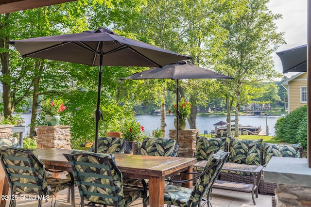 83 Pilot Knob Rd, Queensbury, NY 12804 - view of patio / terrace with outdoor dining area and a water view