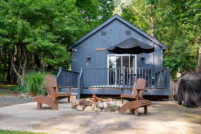 83 Pilot Knob Rd, Queensbury, NY 12804 - view of front of property with a wooden deck and a patio area
