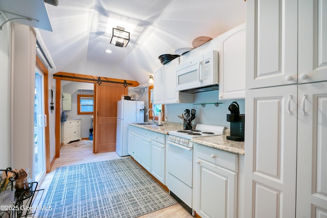 83 Pilot Knob Rd, Queensbury, NY 12804 - kitchen featuring white appliances, lofted ceiling, white cabinets, light stone countertops, and light wood-style flooring