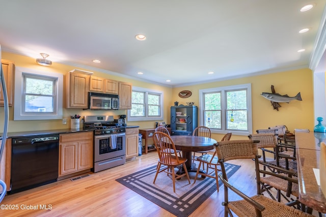 83 Pilot Knob Rd, Queensbury, NY 12804 - kitchen featuring appliances with stainless steel finishes, crown molding, light wood finished floors, dark countertops, and recessed lighting