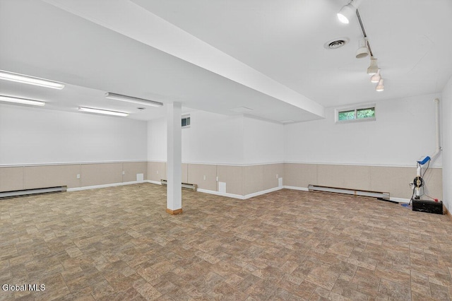 3 Pine Ridge Rd, Saratoga Springs, NY 12866 - below grade area featuring baseboard heating and track lighting