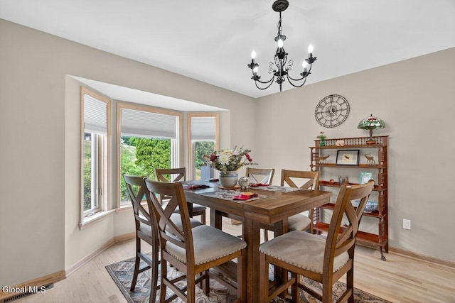 3 Pine Ridge Rd, Saratoga Springs, NY 12866 - dining area featuring a chandelier and light wood-type flooring