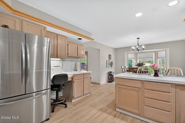3 Pine Ridge Rd, Saratoga Springs, NY 12866 - kitchen with freestanding refrigerator, light brown cabinetry, light countertops, recessed lighting, and a chandelier