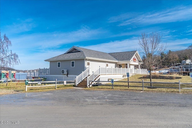3 Pine Ridge Rd, Saratoga Springs, NY 12866 - view of front facade featuring a fenced front yard and roof with shingles