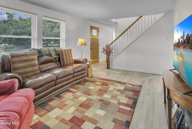 27 Wendell Dr, Colonie, NY 12205 - living room with wood finished floors and stairway