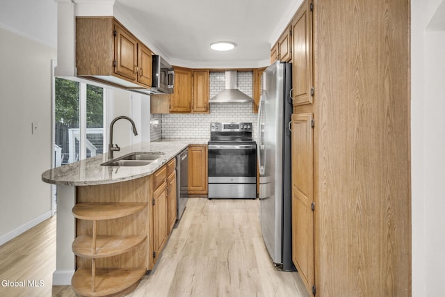 27 Wendell Dr, Colonie, NY 12205 - kitchen featuring appliances with stainless steel finishes, wall chimney range hood, open shelves, light wood-type flooring, and backsplash