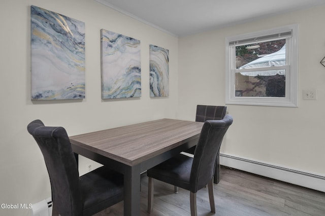 27 Wendell Dr, Colonie, NY 12205 - dining room with wood finished floors, baseboard heating, and ornamental molding