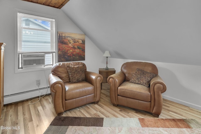 27 Wendell Dr, Colonie, NY 12205 - living area featuring a baseboard radiator, vaulted ceiling, wood finished floors, and cooling unit