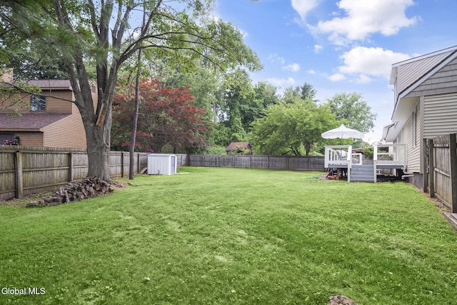 27 Wendell Dr, Colonie, NY 12205 - fenced backyard with a wooden deck and a storage unit