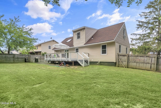 27 Wendell Dr, Colonie, NY 12205 - back of house featuring a deck, a fenced backyard, and a shingled roof