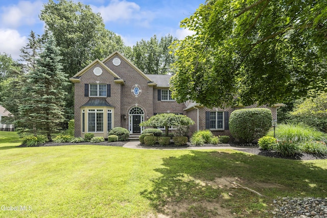222 Bell Ct, Guilderland, NY 12303 - view of front of property featuring brick siding and a front yard