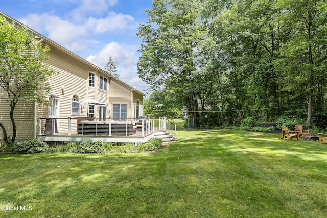 222 Bell Ct, Guilderland, NY 12303 - view of grassy yard featuring a deck